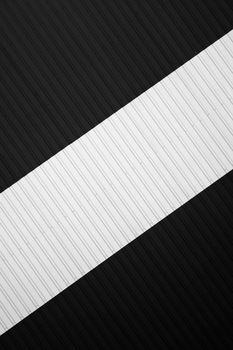 Black and white corrugated iron sheet used as a facade of a warehouse or factory. Texture of a seamless corrugated zinc sheet metal aluminum facade. Architecture. Metal texture