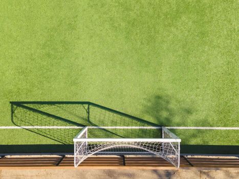 Green Soccer Court Detail .Outdoor sport ground with green surface for playing football  or soccer  in urban area, detail.