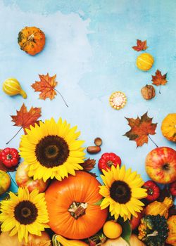 Fall fruits and vegetables with golden sunflowers. Still life composition, can be used for Thanksgiving concepts,  Halloween or  autumn  harvest.Top view, blank space, rustic background