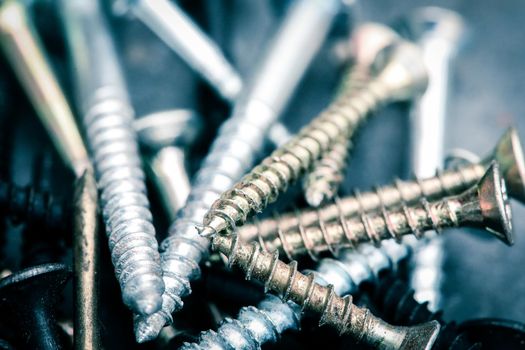 Different Kind of Screws on a table in a workshop