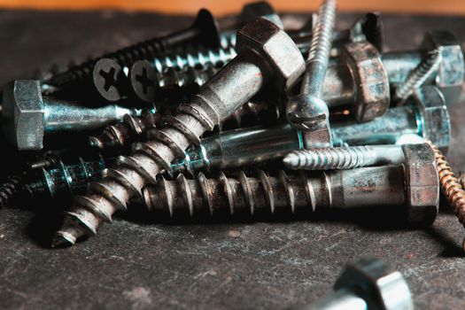 Different Kind of Screws on a table in a workshop