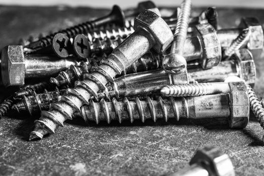 Different Kind of Screws on a table in a workshop