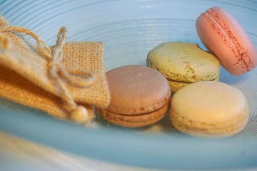 Macarons in different colours on a background 