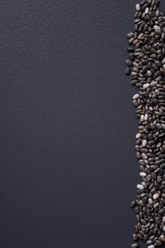 chia seeds on gray background, top view, copy space.