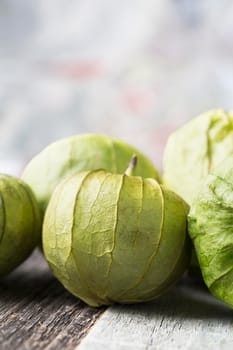 Close up of tomatillos with copy space, vertical orientation.
