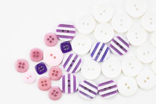 Colorful button texture with pink, purple and white buttons.