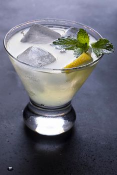 Fresh Lemon cocktail or lemonade garnished with fresh mint leaves