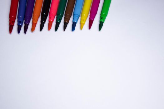 multicolored felt-tip pens on a white background. stationery concept. copy space. isolated. High quality photo