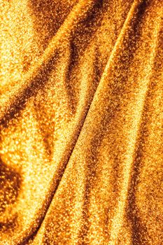 Luxe glowing texture, night club branding and New Years party concept - Golden holiday sparkling glitter abstract background, luxury shiny fabric material for glamour design and festive invitation