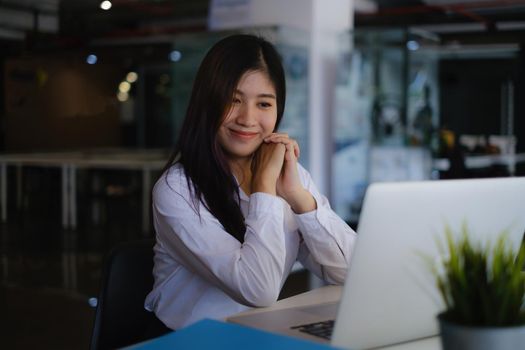 Online class. Happy asian female using laptop for online learning at home