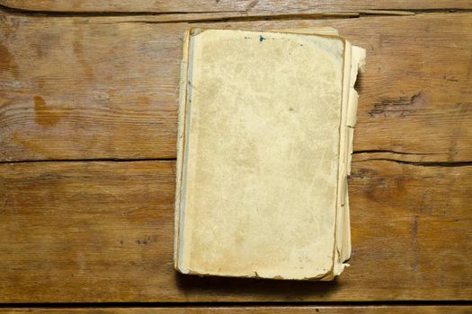 detailed antique book with blank cover on the vintage wooden table top