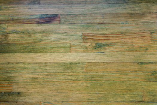 weathered wooden background with green tint