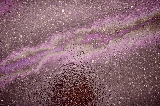 Oil stain on Asphalt, color Gasoline fuel spots on Asphalt Road as Texture or Background
