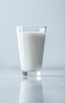 Dairy, healthy nutrition and breakfast concept - World Milk Day, full glass on marble table