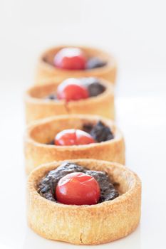 Savory tartlet with mushrooms and tomatoes.
