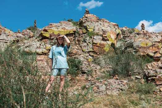 Domestic tourism, travel, lesure concept - woman in Altai mountains, beauty summer day