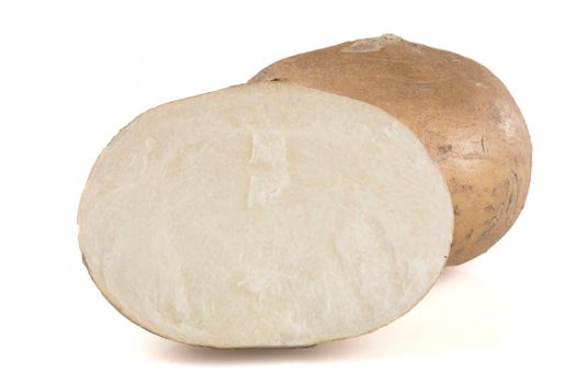 Fresh jicama isolated on a white background with shadow.