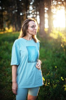 Healthy lifestyle woman walking in mountains in summer forest area