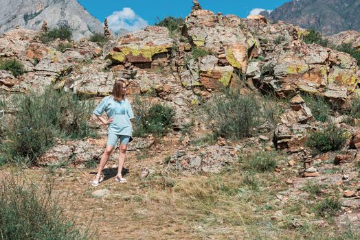 Domestic tourism, travel, lesure concept - woman in Altai mountains, beauty summer day