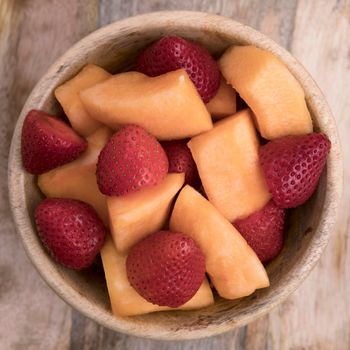 Bowl of fresh strawberries and cantaloup