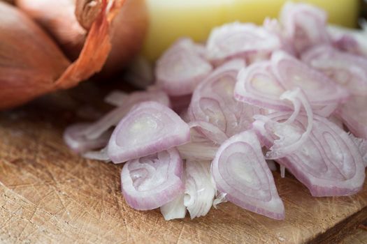 Sliced fresh shallots on a cutting board