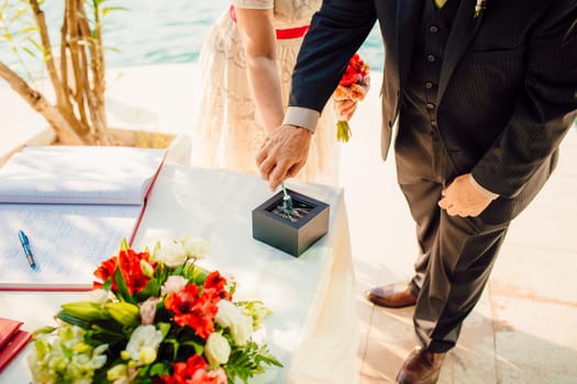 Wedding rings of the newlyweds. Engagement gold rings. Wedding in Montenegro.