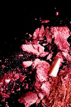 Crushed cosmetics, mineral organic eyeshadow, blush and cosmetic powder isolated on black background, makeup and beauty banner, flatlay design.