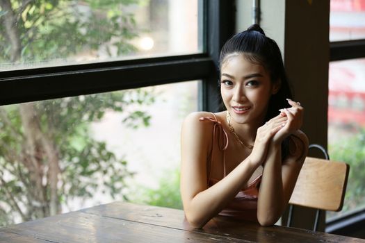 elegant sensual young woman in brown dress on recamier outdoor shot