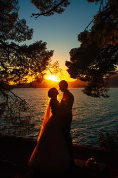 Silhouettes at sunset on the beach in Montenegro