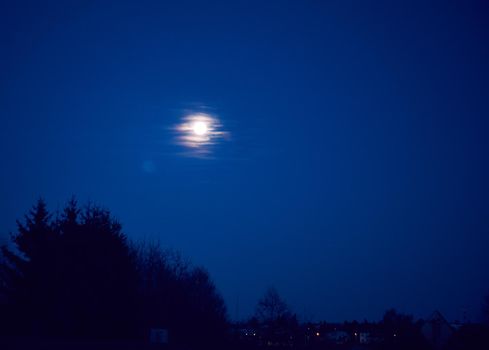 moon on night sky during blue hour