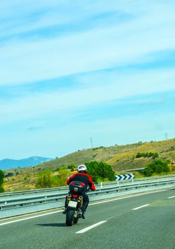 Fast road in the mountains in Spain, beautiful landscape of mountains, dry earth and rock from the sun, transportation