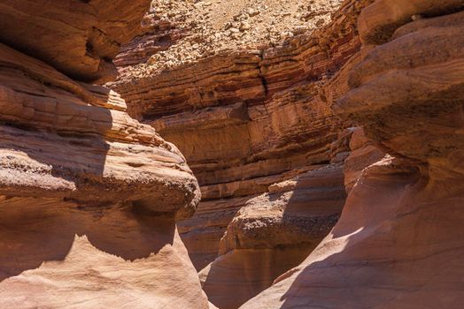 An amazing place in Israel is called the Red canyon and Nahal Shani, Southern District. Totally worth visiting because of its stunning stony structure. High quality photo