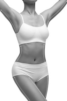 Dotted lines on beautiful female body. Closeup of woman slim fit body with white marks, isolated on white background