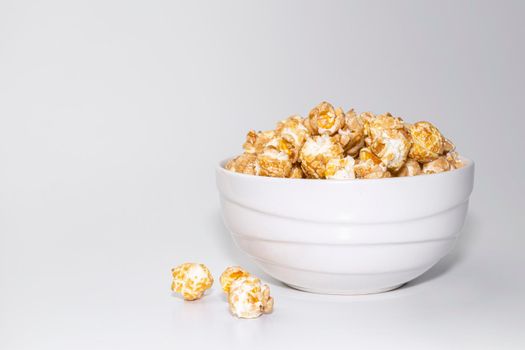 a cup of popcorn on a gray background . copy space. High quality photo