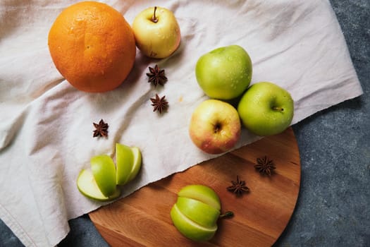 Fresh apples, grapefruit and anise on the linen cloth.