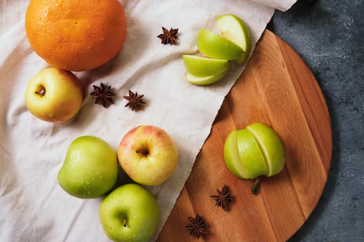 Fresh apples, grapefruit and anise on the linen cloth.