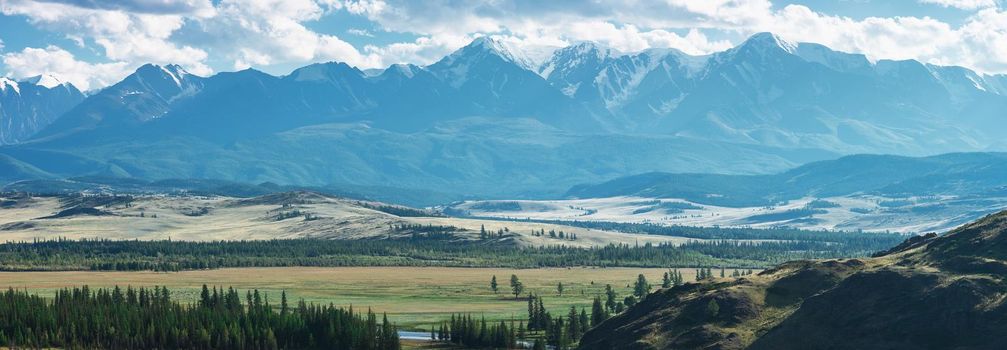 Kurai steppe and North-Chui ridge on background. Altai mountains, Russia. Panoramic picture