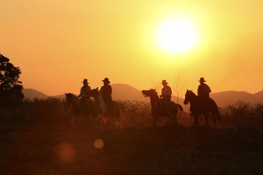 cowboy and horse at first light,mountain, river and lifestyle with natural light background	