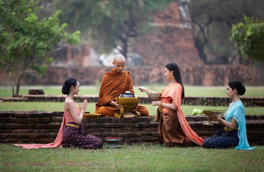 The women gave food to monk