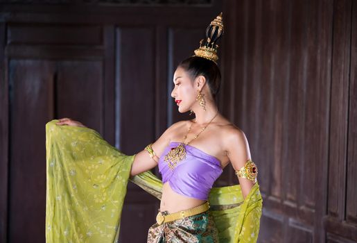 Beautiful woman, Thai national costume, traditional Thai dress, Thai woman, good mood, beautiful smile background - Image with noise and grain