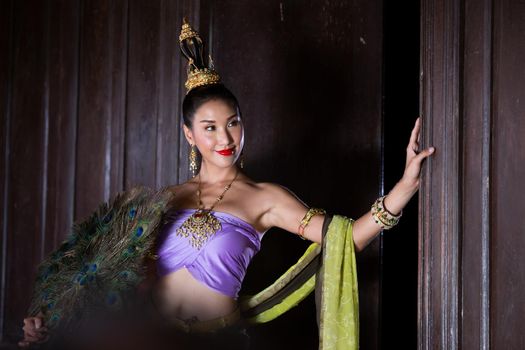 Beautiful woman, Thai national costume, traditional Thai dress, Thai woman, good mood, beautiful smile background - Image with noise and grain