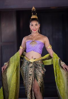 Beautiful woman, Thai national costume, traditional Thai dress, Thai woman, good mood, beautiful smile background - Image with noise and grain