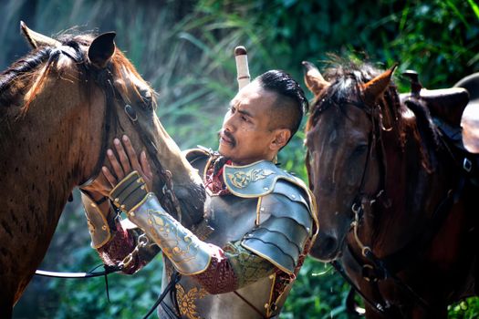 Aisan Thai soldier in the history scene with armor suit costume and horse	
