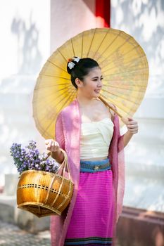 Lanna woman north thailand, Thailand or Thai costume Asian dress concept. Young Thai beautiful woman is walking in the Buddhist temple in Ayutthaya.