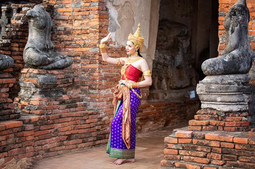 Beautiful woman, Thai national costume, traditional Thai dress, Thai woman, good mood, beautiful smile background - Image with noise and grain