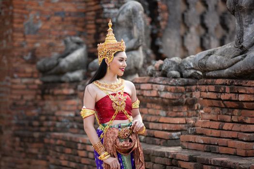 Beautiful woman, Thai national costume, traditional Thai dress, Thai woman, good mood, beautiful smile background - Image with noise and grain