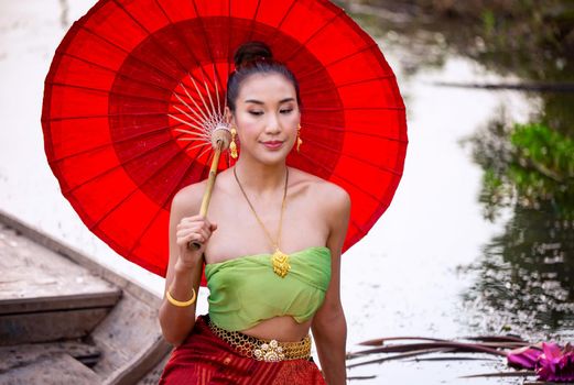 Beautiful woman, Thai national costume, traditional Thai dress, Thai woman, good mood, beautiful smile background - Image with noise and grain