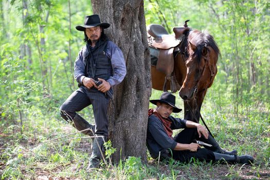 cowboy and horse at first light,mountain, river and lifestyle with natural light background