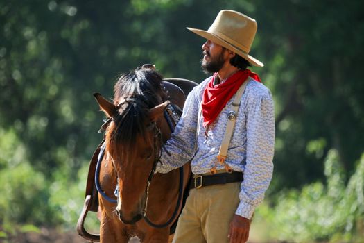 cowboy and horse at first light,mountain, river and lifestyle with natural light background	