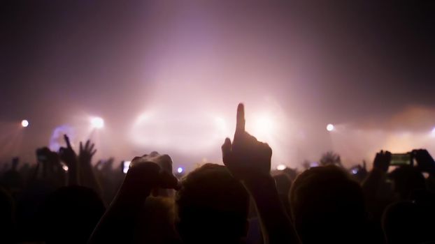 Concert Music festival and Celebrate. Party People Rock Concert. Crowd Happy and Joyful and Applauding or Clapping. Celebration party festival happiness. Blurry night club. Concert Show with DJ Music festival EDM on Stage